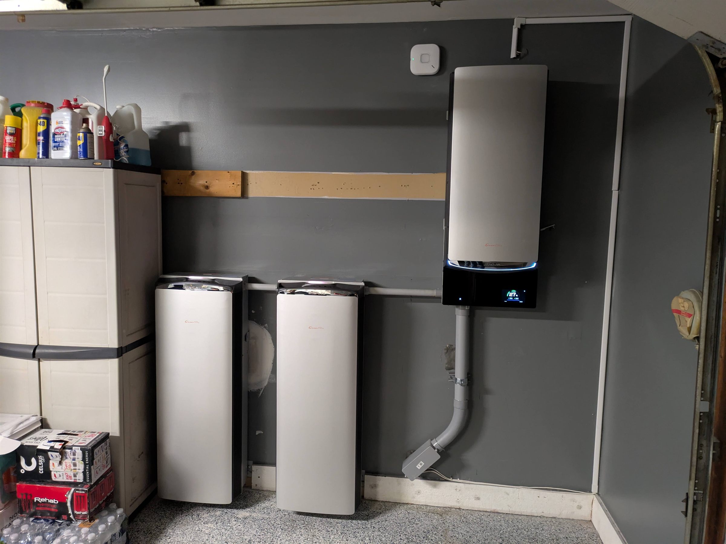 Home battery storage units and inverter mounted in a garage by Augustine Solar