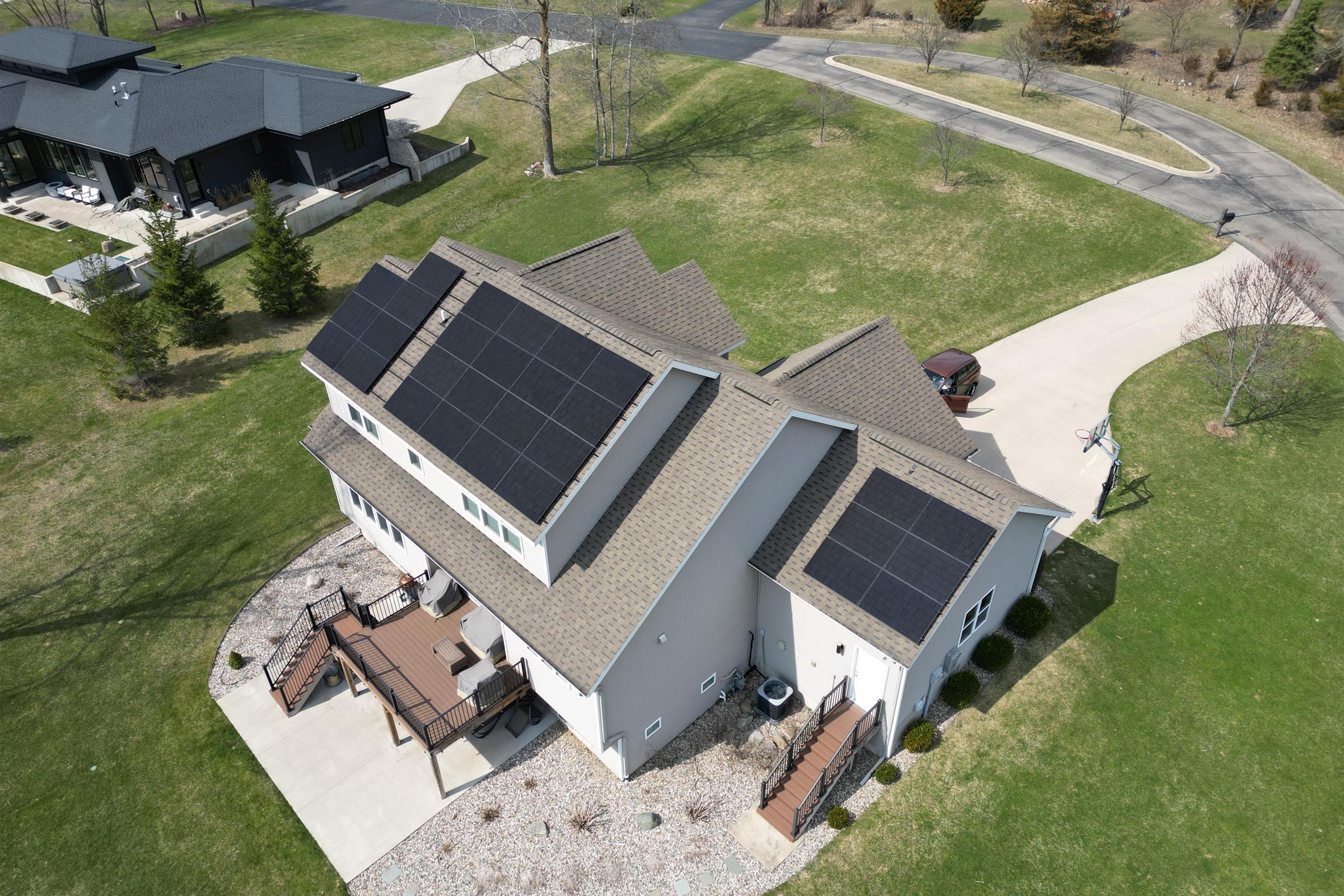 Completed residential solar array spanning two roof planes of a West Michigan home